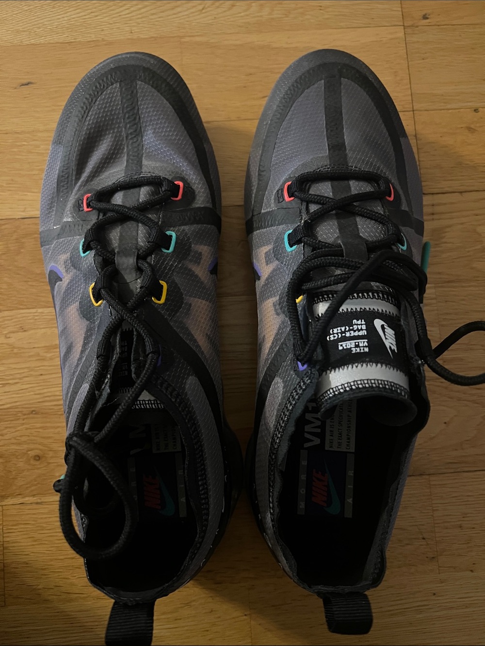 Nike Men’s Gray Sneakers with Rainbow Eyelet Accents